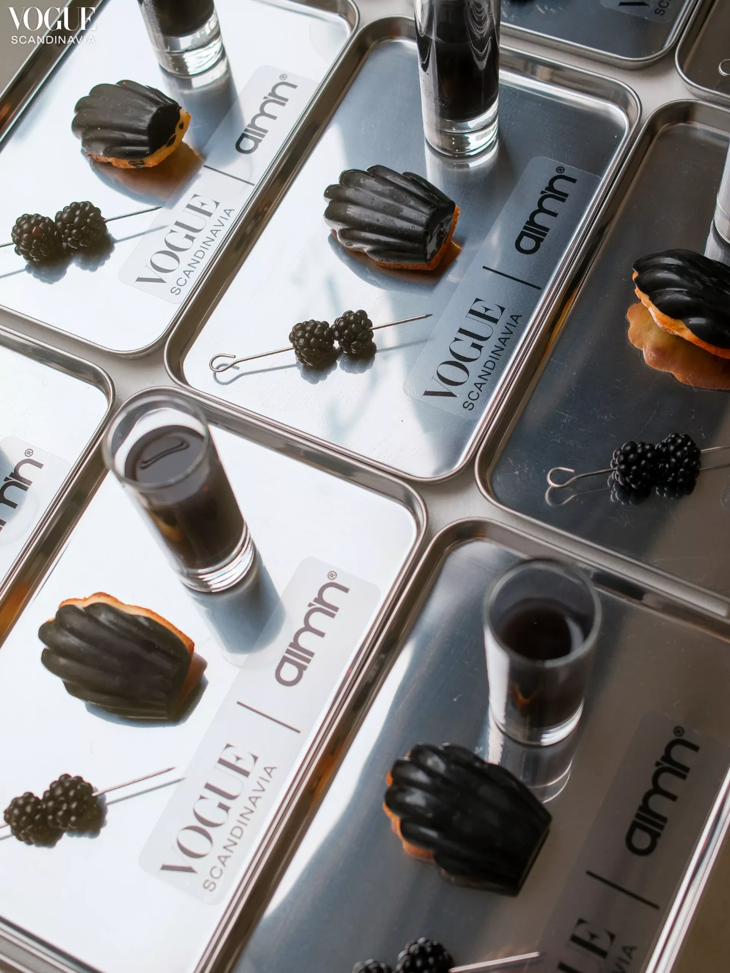 Branded pastries on metal trays for the Aim'n x Vogue Scandinavia Copenhagen Fashion Week activation